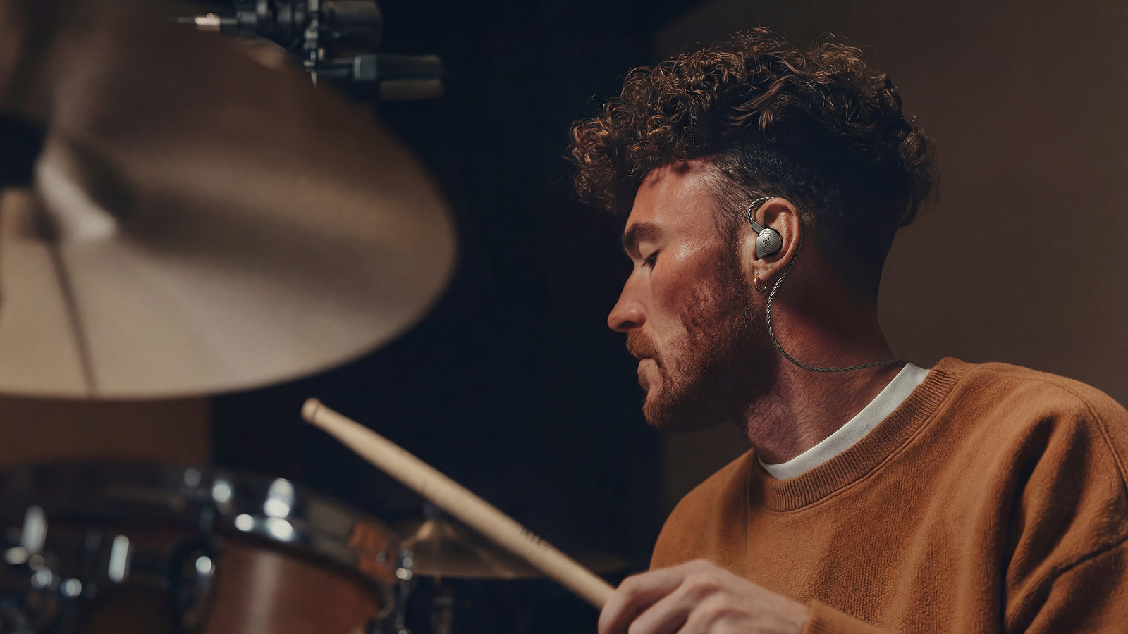 Drummer wearing Wave Pro IEMs