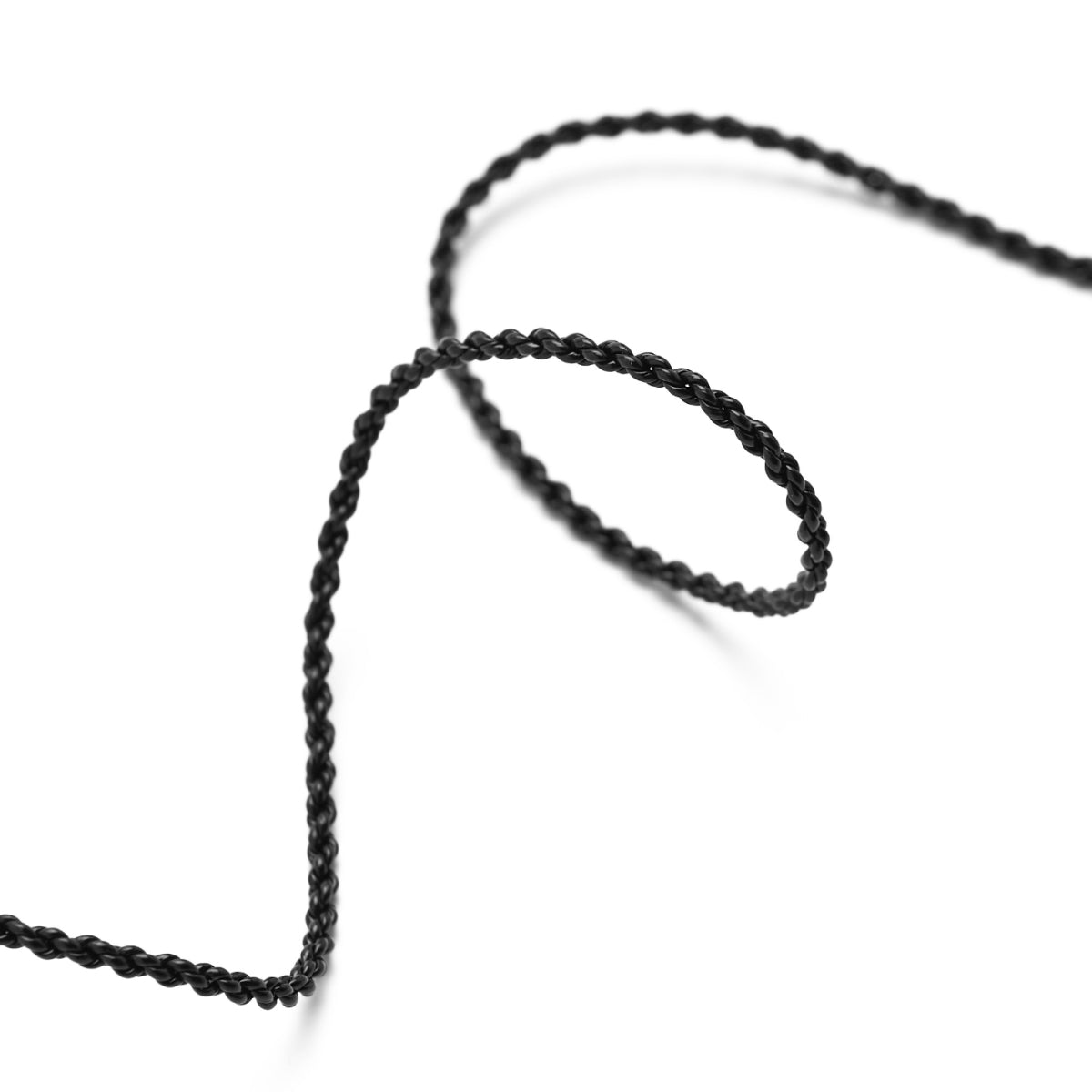 Close-up of a black braided audio cable loop