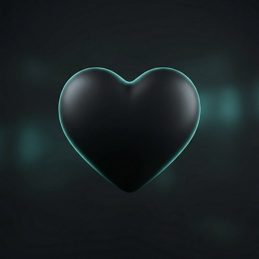 Black heart sculpture against a dark background