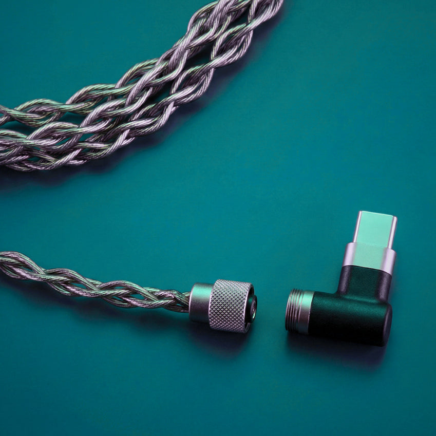 Braided audio cable with a USB-C connector on a teal background