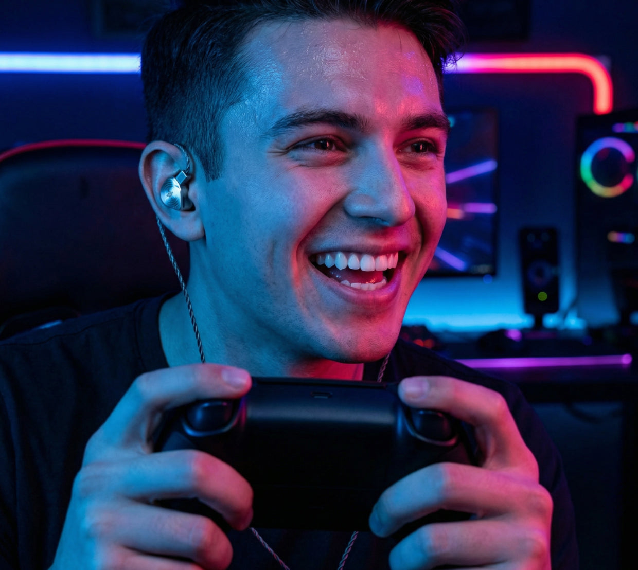 Gamer wearing a Wave Pro in-ear monitor while holding a game controller
