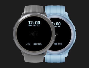 Two round wearable metronomes with gray and light blue bands displaying the time
