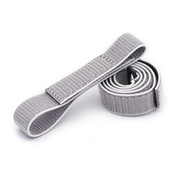 Gray Spark body strap coiled on a white background