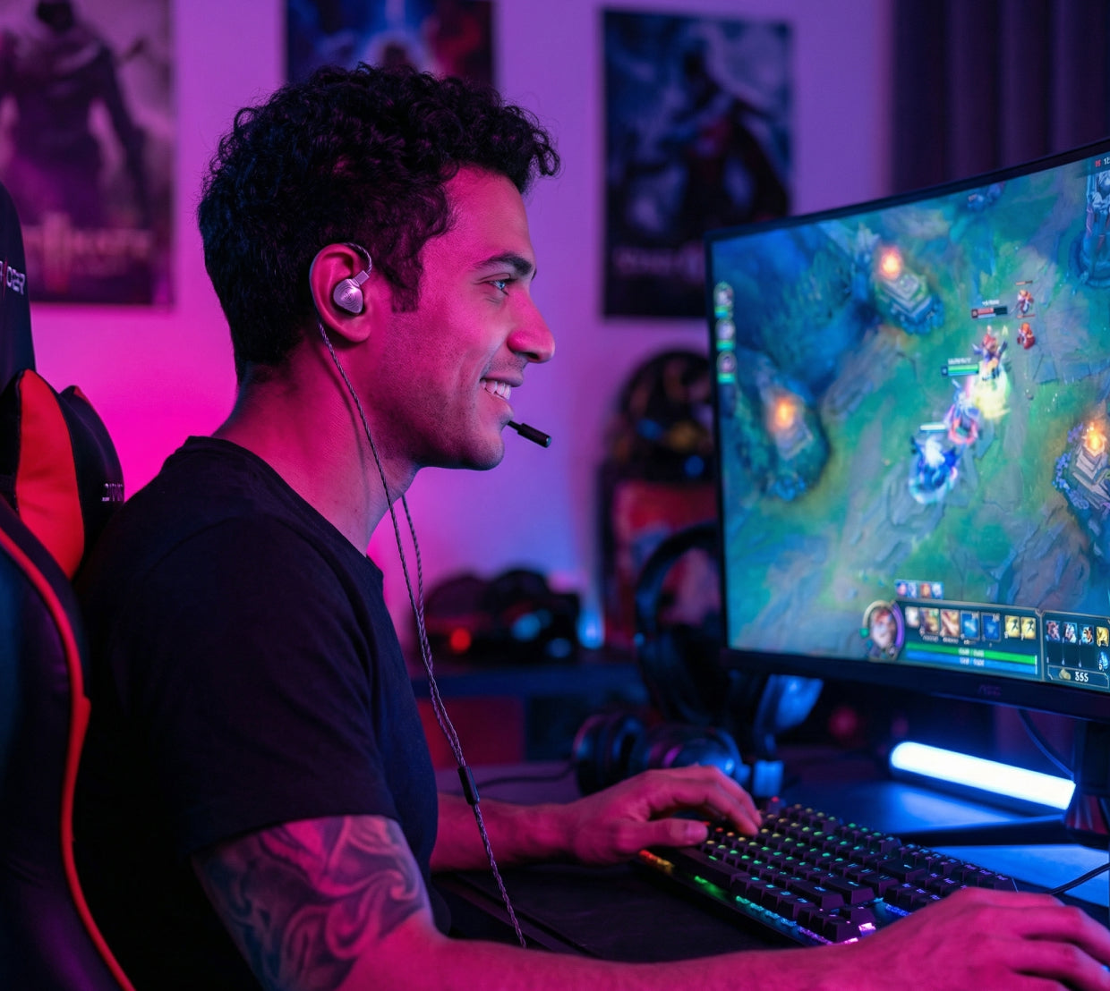 Man wearing wired in-ear monitors while playing a video game at a computer