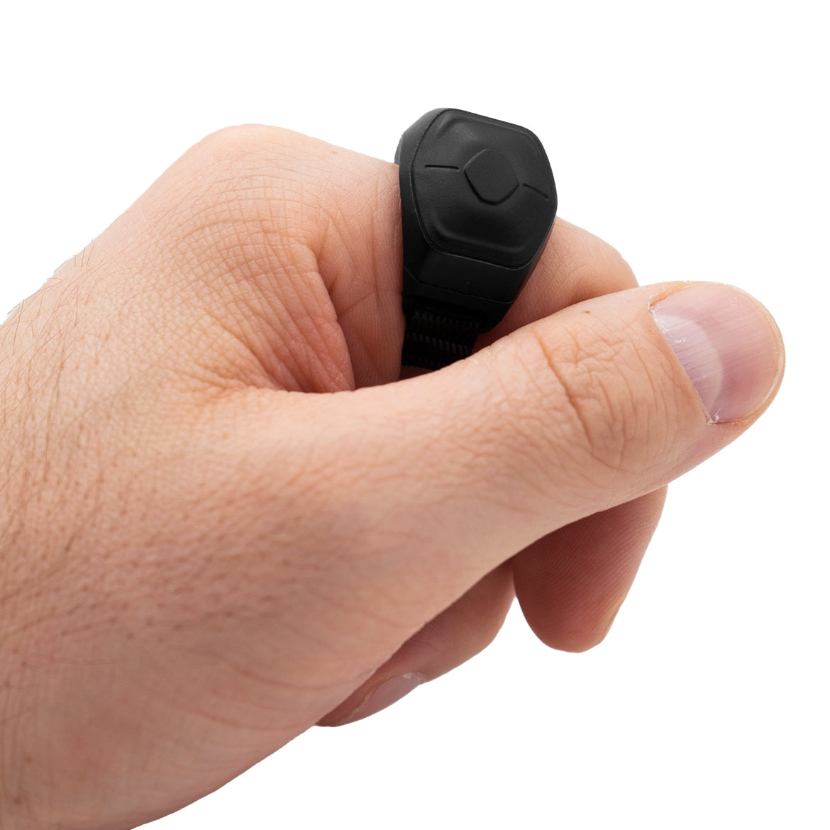 A hand holding the black Genki Wave MIDI ring between two fingers