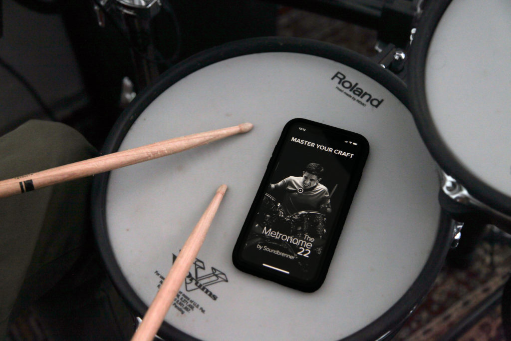 Mobile phone placed on drum with the Soundbrenner metronome app opwn